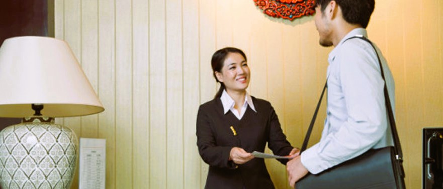 The hotel staff welcomes the visitor
